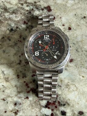 Tissot Black Dial Chronograph Watch with Red Accents